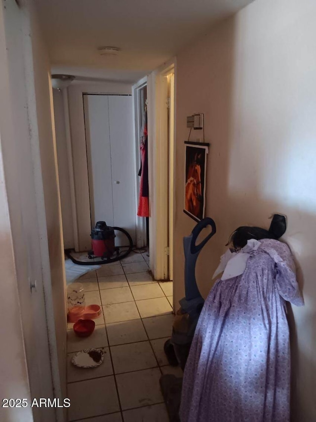 hallway featuring tile patterned flooring