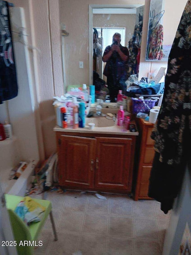 bathroom with tile patterned flooring and vanity