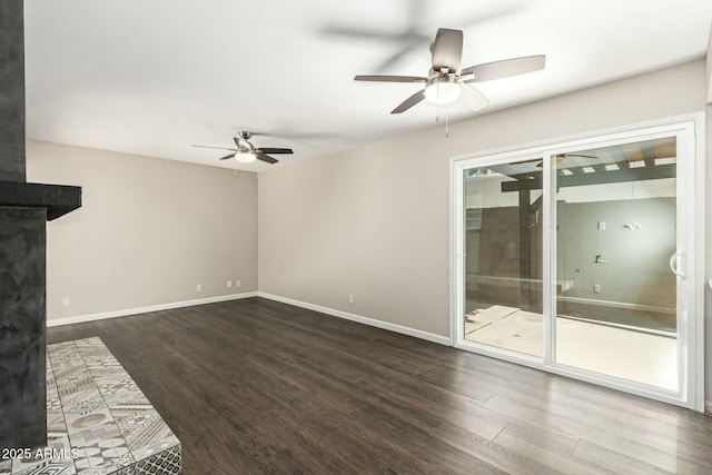 unfurnished living room featuring dark hardwood / wood-style floors and ceiling fan