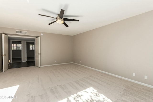 carpeted empty room with ceiling fan