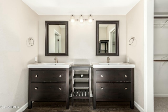 bathroom featuring vanity and wood-type flooring