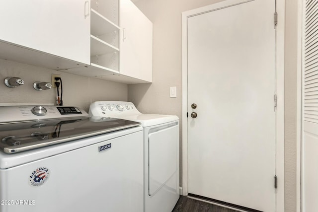 laundry room with washing machine and dryer and dark hardwood / wood-style floors