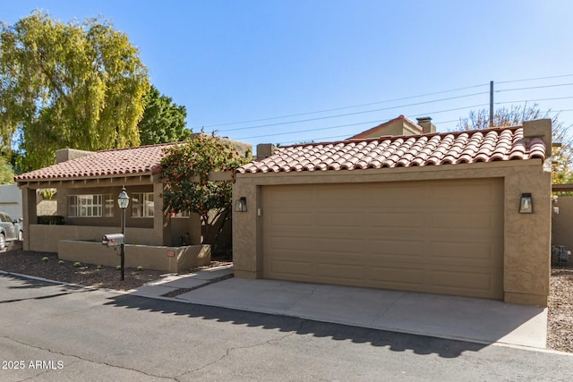 mediterranean / spanish house featuring a garage