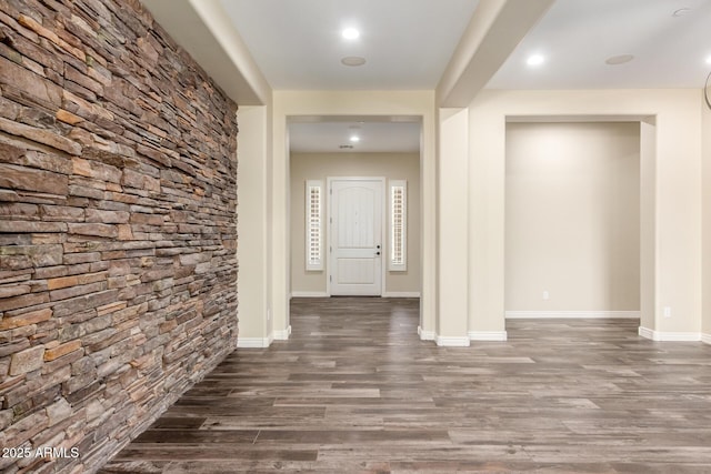 interior space featuring baseboards, wood finished floors, and recessed lighting