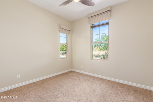 unfurnished room with ceiling fan, carpet flooring, and baseboards