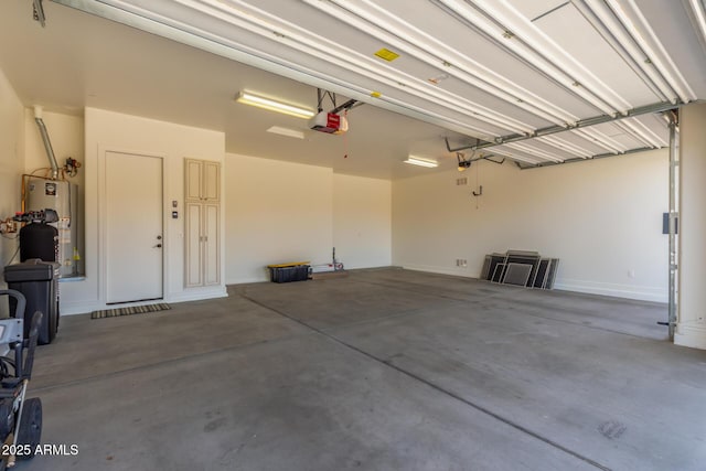 garage with a garage door opener and water heater