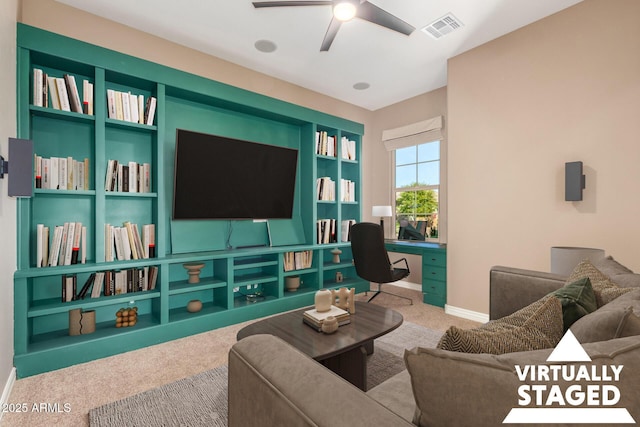 living area featuring a ceiling fan, carpet, visible vents, and baseboards