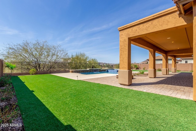 view of yard with a fenced backyard, a fenced in pool, and a patio