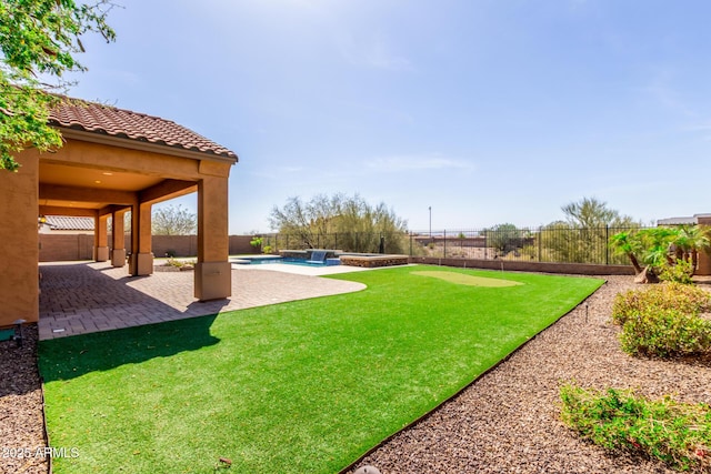 view of yard with a fenced in pool, a fenced backyard, and a patio