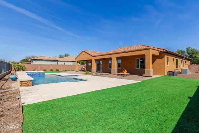 view of swimming pool with a fenced in pool, a yard, a patio, central air condition unit, and a fire pit