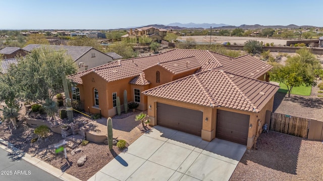 birds eye view of property with a mountain view