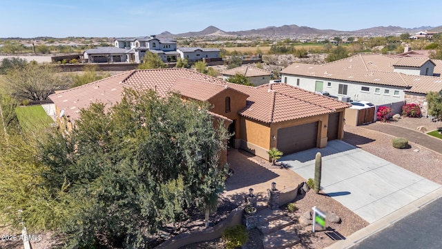 bird's eye view featuring a residential view and a mountain view