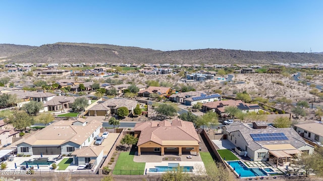 drone / aerial view featuring a mountain view and a residential view