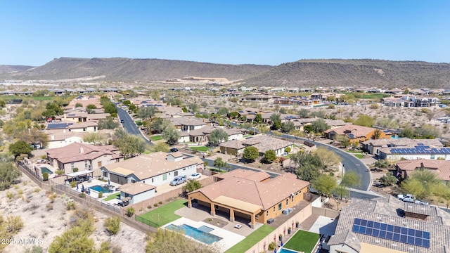 drone / aerial view featuring a residential view and a mountain view