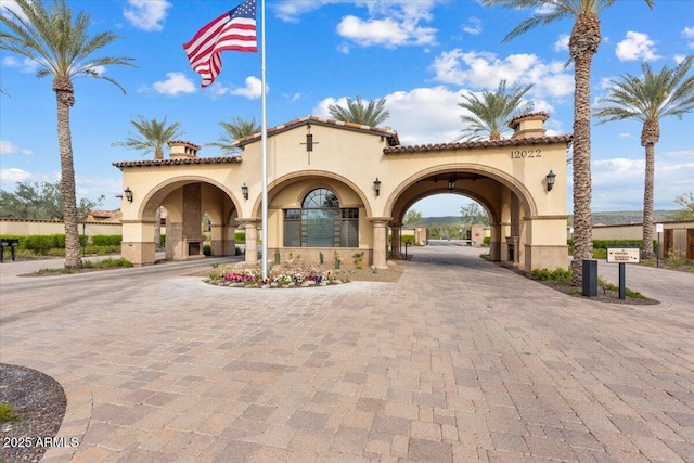 view of property with decorative driveway