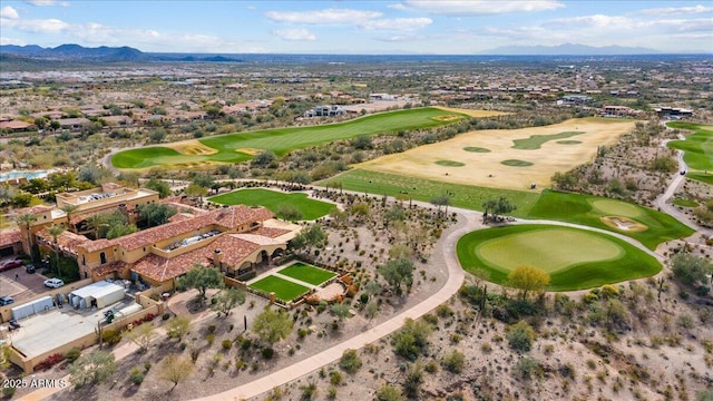 aerial view featuring golf course view and a mountain view