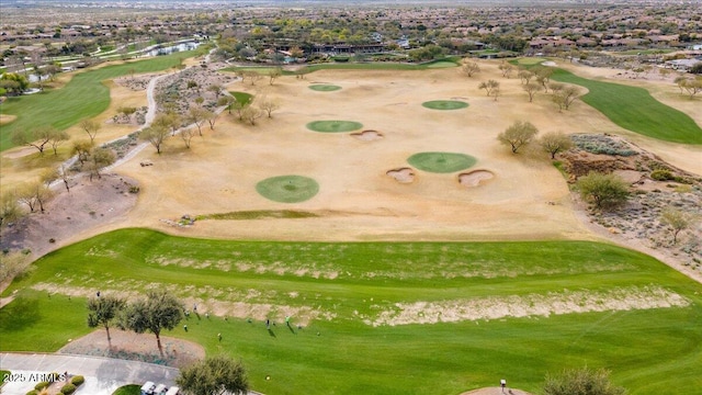 bird's eye view with view of golf course