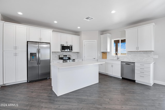 10784 E Angus Ln, Coolidge, AZ 85128 - kitchen featuring white cabinets, visible vents, a sink, stainless steel appliances, and decorative backsplash