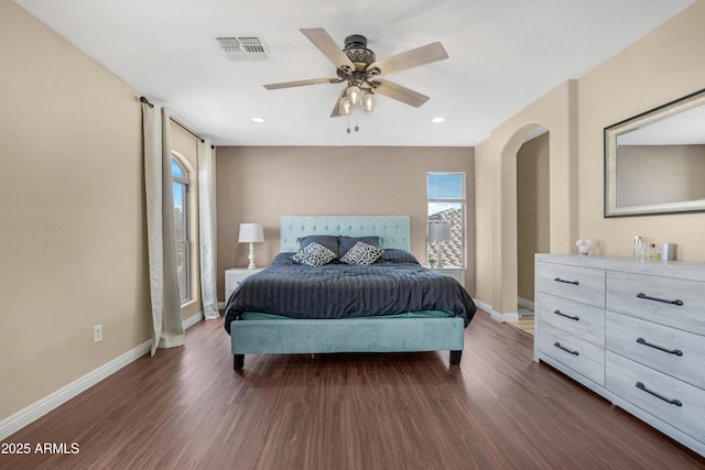 bedroom with dark wood-type flooring and ceiling fan