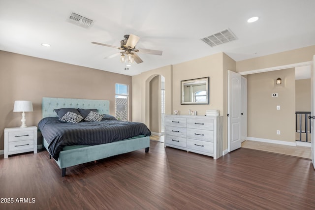 bedroom featuring ceiling fan and dark hardwood / wood-style flooring