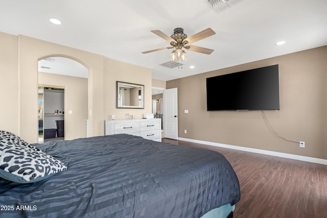 bedroom with dark hardwood / wood-style floors and ceiling fan