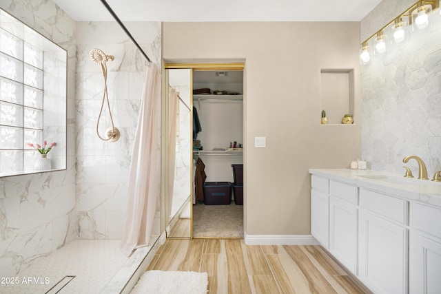 bathroom featuring vanity and walk in shower