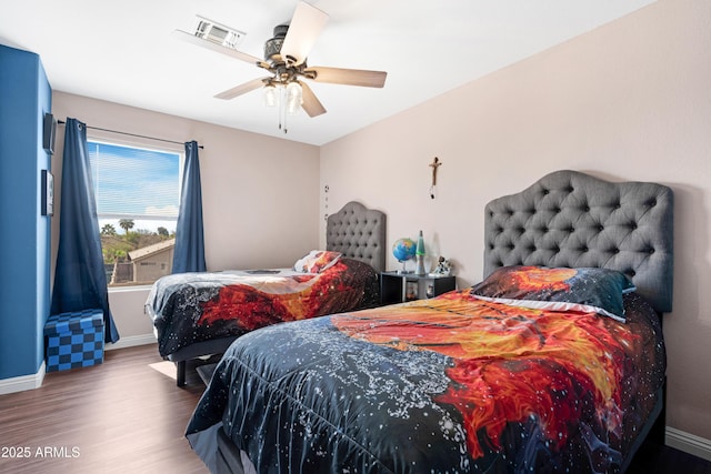 bedroom featuring hardwood / wood-style flooring and ceiling fan