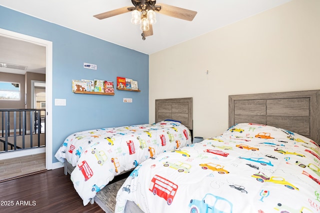 bedroom featuring dark hardwood / wood-style floors and ceiling fan