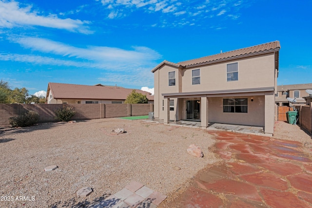 rear view of house featuring a patio area