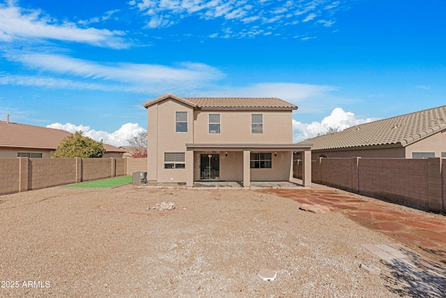 back of house with central AC unit and a patio area