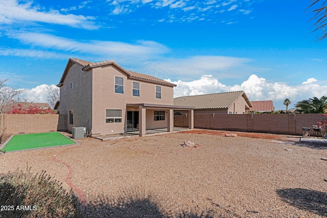 rear view of house featuring a patio and cooling unit