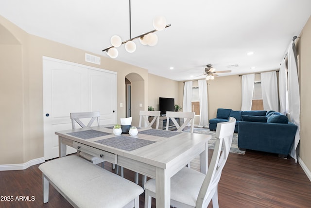 dining area featuring dark hardwood / wood-style floors and ceiling fan