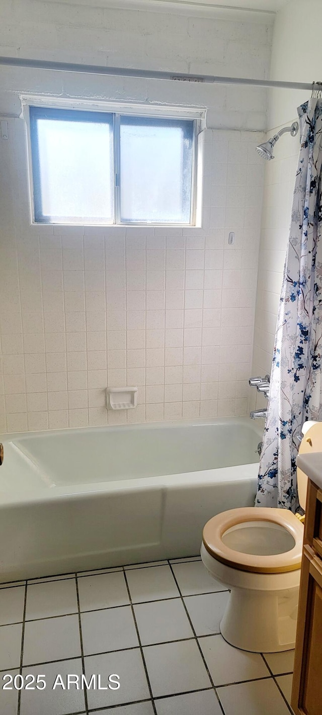 full bathroom featuring shower / tub combo, vanity, toilet, and tile patterned floors