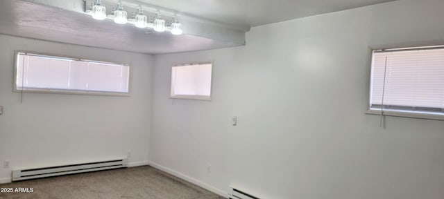 unfurnished room featuring carpet floors, baseboards, and baseboard heating