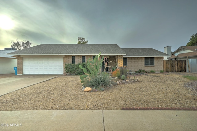 ranch-style home featuring a garage