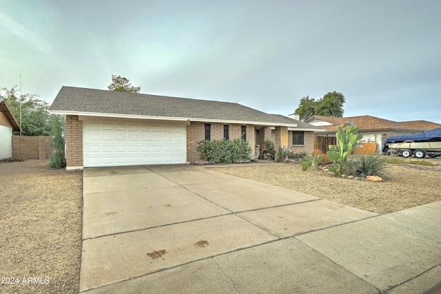 ranch-style home featuring a garage