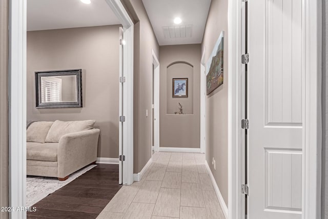 corridor featuring hardwood / wood-style flooring