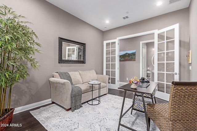 living room with french doors and hardwood / wood-style floors