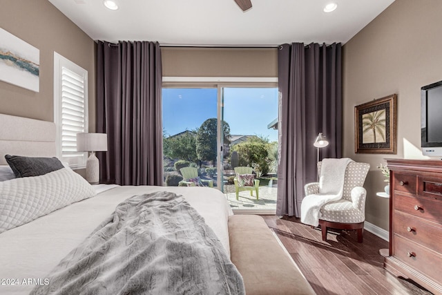 bedroom with wood-type flooring, access to outside, and ceiling fan