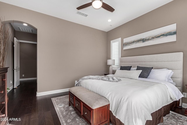 bedroom with ceiling fan and dark hardwood / wood-style floors