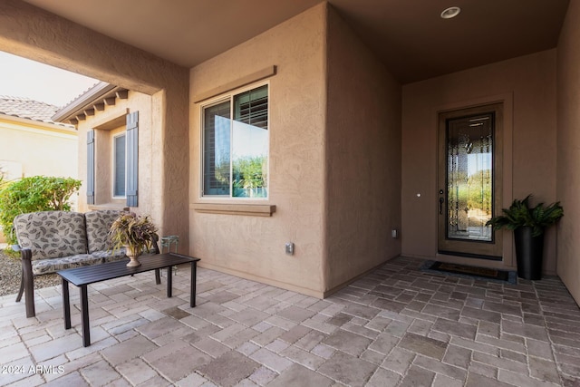 entrance to property featuring a patio area