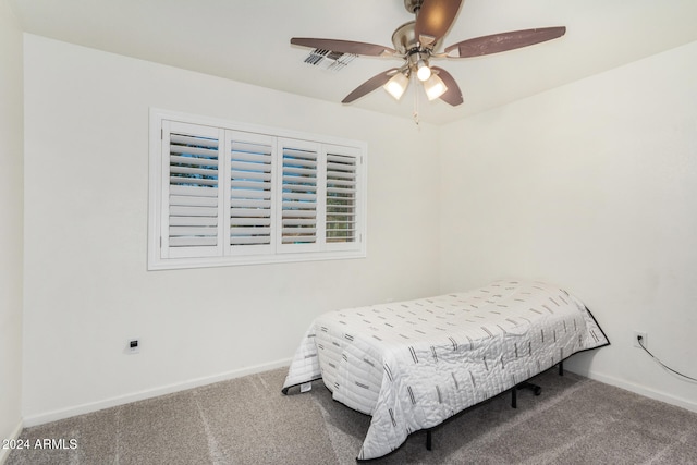 bedroom with a ceiling fan, carpet, visible vents, and baseboards