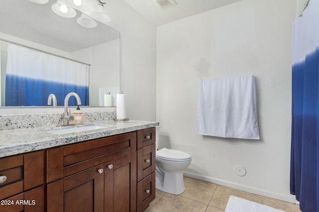 full bathroom featuring visible vents, toilet, vanity, tile patterned flooring, and baseboards