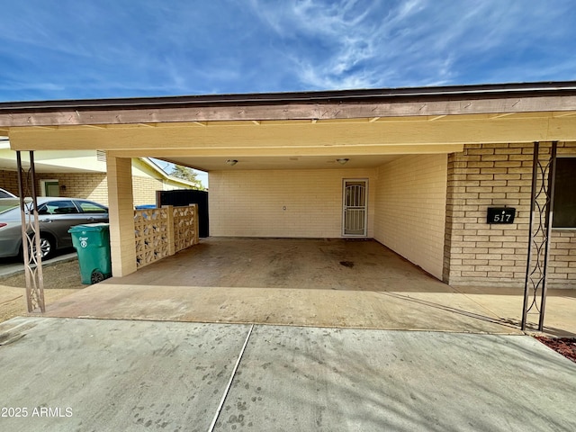 view of parking / parking lot featuring a carport