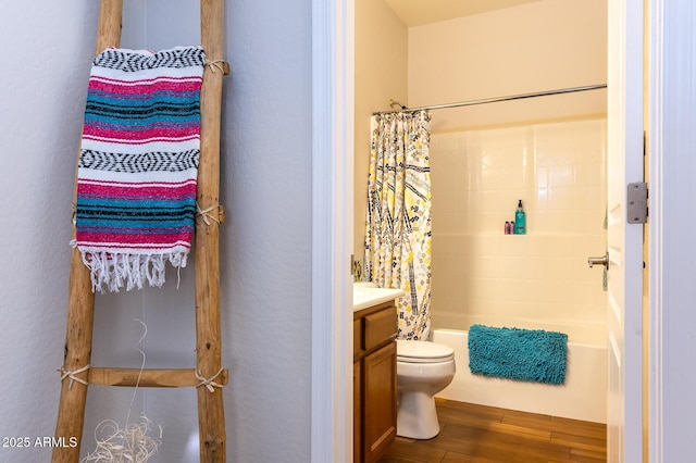 full bathroom featuring hardwood / wood-style floors, vanity, toilet, and shower / bathtub combination with curtain