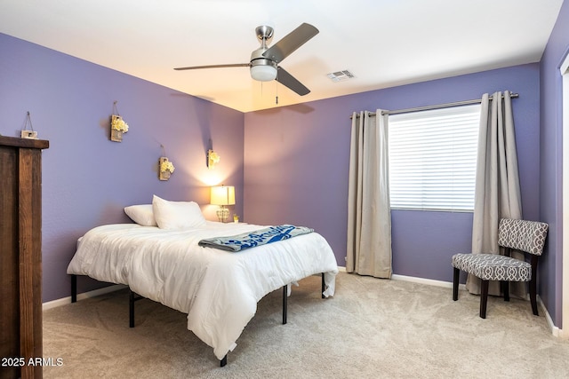 bedroom with ceiling fan and light colored carpet