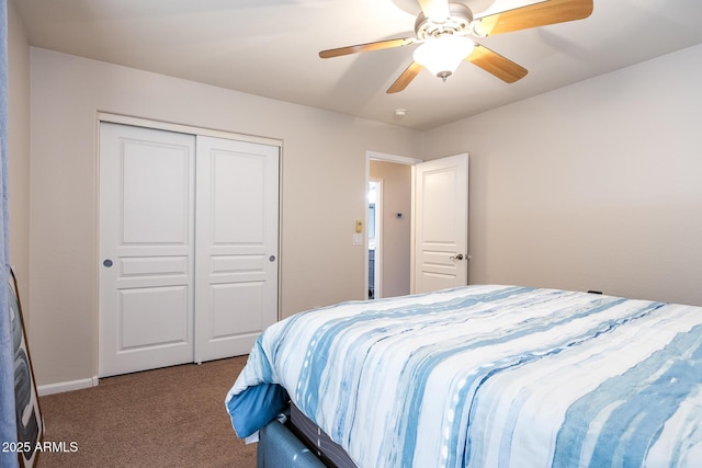 carpeted bedroom with ceiling fan and a closet