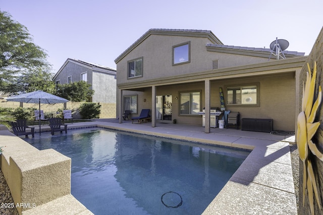 view of swimming pool featuring a patio area