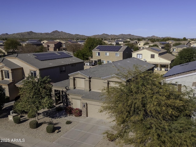 birds eye view of property with a mountain view