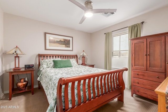 bedroom with a ceiling fan, light colored carpet, visible vents, and baseboards